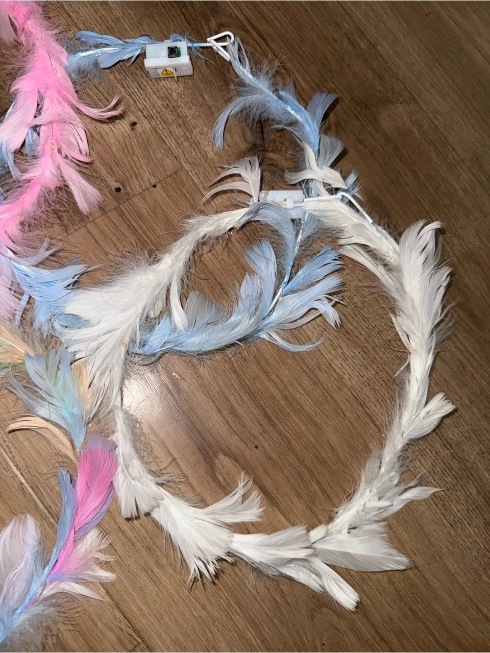 Brand new pack of 4 feather light up rave head bands